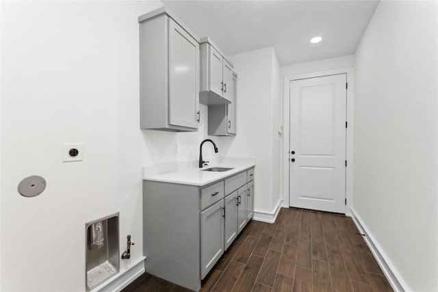 7026 Troyan, Temple, TX 76502 - washroom with electric dryer hookup, cabinet space, dark wood-style flooring, and recessed lighting