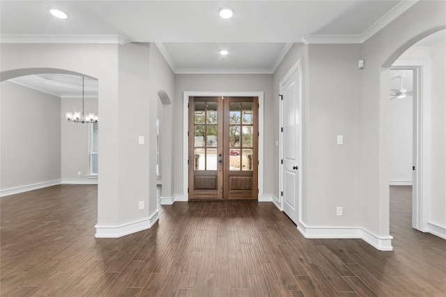 7026 Troyan, Temple, TX 76502 - foyer entrance featuring dark wood-style floors, arched walkways, french doors, a chandelier, and recessed lighting