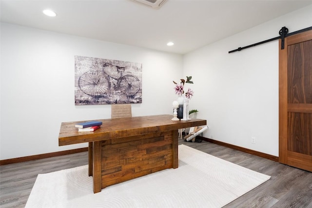 4604 Fawnwood Cv, Austin, TX 78735 - office space featuring a barn door, wood finished floors, and recessed lighting