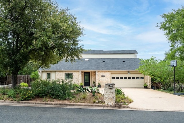4604 Fawnwood Cv, Austin, TX 78735 - view of front of property featuring stone siding, an attached garage, driveway, and a shingled roof