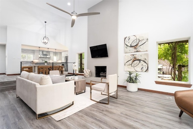 4604 Fawnwood Cv, Austin, TX 78735 - living room featuring high vaulted ceiling, wood finished floors, and a ceiling fan