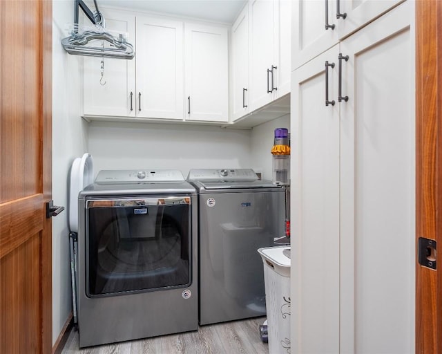 4604 Fawnwood Cv, Austin, TX 78735 - washroom featuring cabinet space, separate washer and dryer, and light wood-style flooring