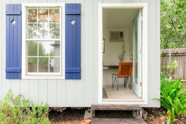 502 E 46th St, Austin, TX 78751 - doorway to property with a wall mounted air conditioner