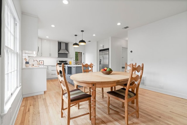 502 E 46th St, Austin, TX 78751 - dining space with light wood-type flooring and recessed lighting