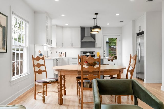 502 E 46th St, Austin, TX 78751 - dining room with light wood finished floors and recessed lighting