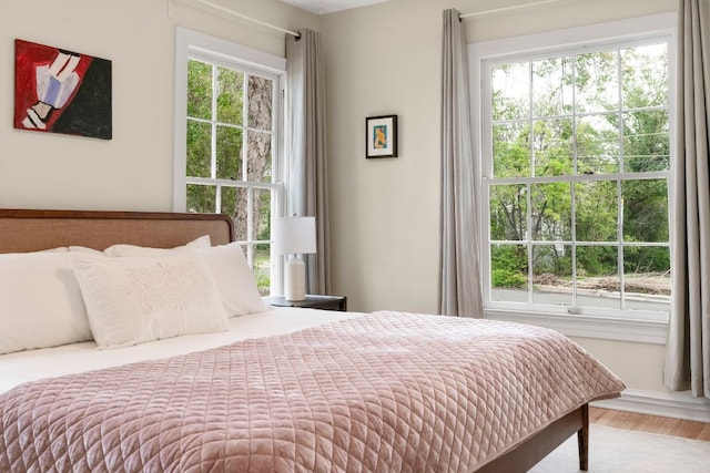 502 E 46th St, Austin, TX 78751 - bedroom featuring wood finished floors and multiple windows