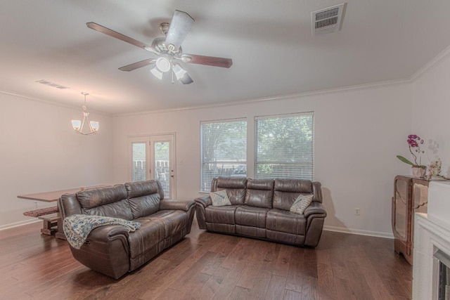 3300 Forest Creek Dr Unit 45, Round Rock, TX 78664 - living area with ornamental molding, wood finished floors, ceiling fan, and a chandelier