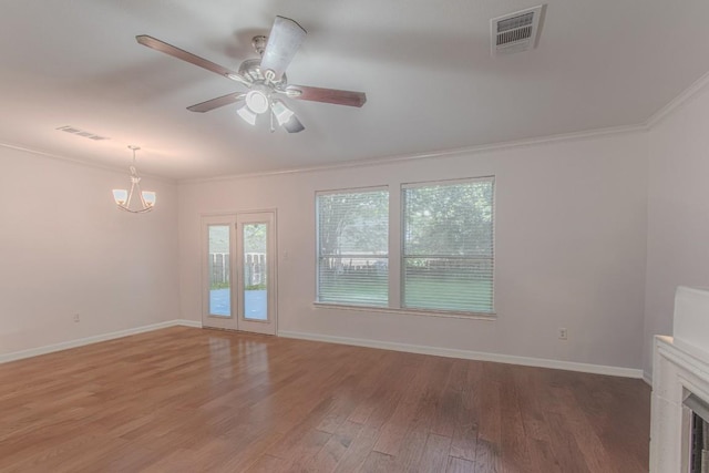 3300 Forest Creek Dr Unit 45, Round Rock, TX 78664 - unfurnished living room with ornamental molding, light wood-style flooring, a chandelier, and a ceiling fan