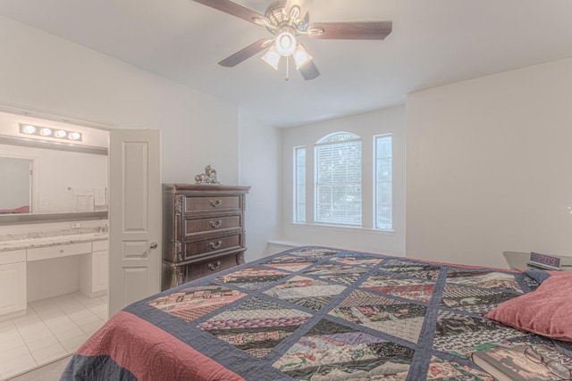 3300 Forest Creek Dr Unit 45, Round Rock, TX 78664 - bedroom with connected bathroom, light tile patterned floors, and ceiling fan