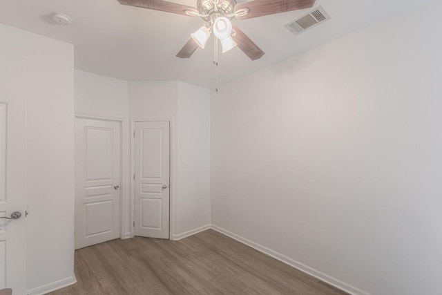 3300 Forest Creek Dr Unit 45, Round Rock, TX 78664 - unfurnished room featuring wood finished floors, a ceiling fan, and a smoke detector