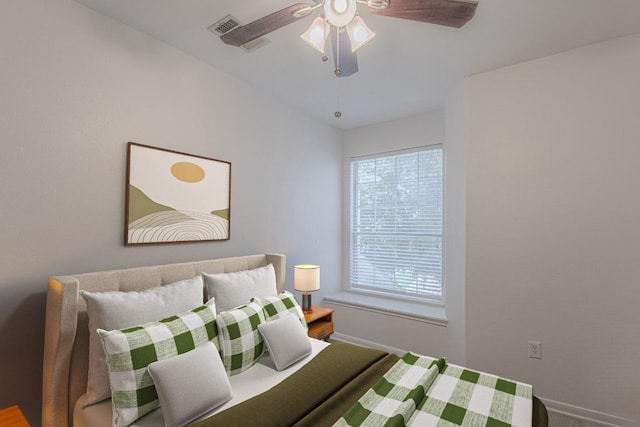 3300 Forest Creek Dr Unit 45, Round Rock, TX 78664 - bedroom with baseboards and ceiling fan