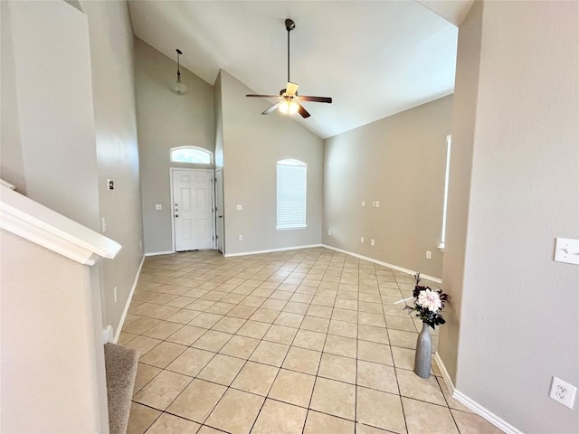 139 Diamondback Cv, Buda, TX 78610 - unfurnished living room with light tile patterned floors, a ceiling fan, and high vaulted ceiling
