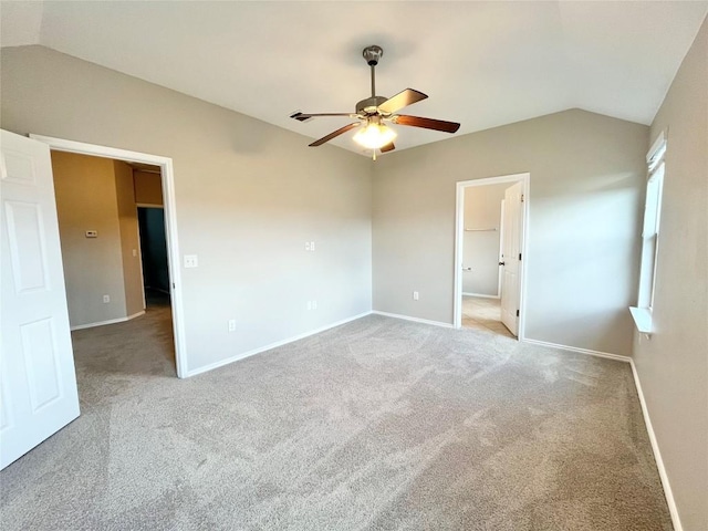 139 Diamondback Cv, Buda, TX 78610 - unfurnished bedroom with vaulted ceiling, carpet floors, and a ceiling fan