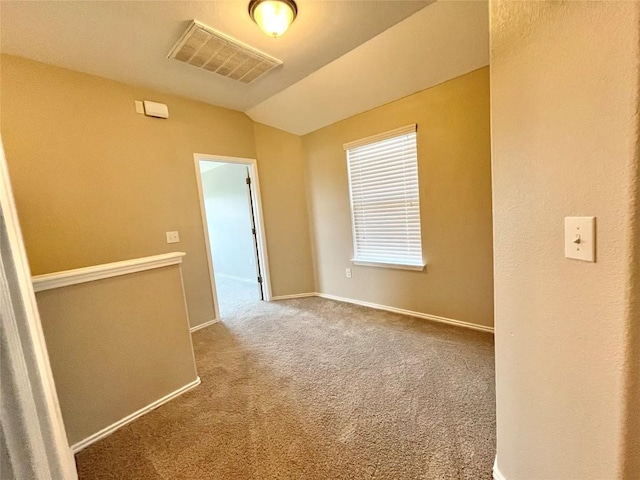139 Diamondback Cv, Buda, TX 78610 - carpeted empty room featuring vaulted ceiling and baseboards