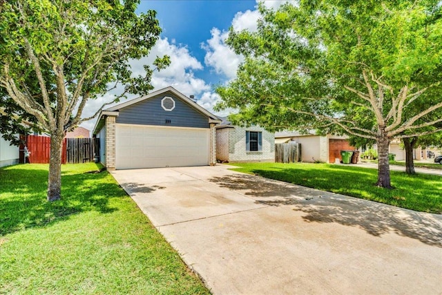 233 Sunshadow Dr, Lockhart, TX 78644 - view of front of house featuring driveway, brick siding, and a garage