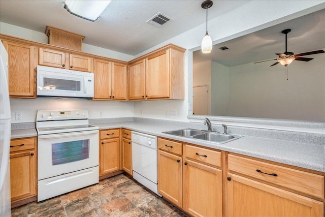 233 Sunshadow Dr, Lockhart, TX 78644 - kitchen featuring white appliances, a ceiling fan, light countertops, stone finish floors, and light brown cabinets
