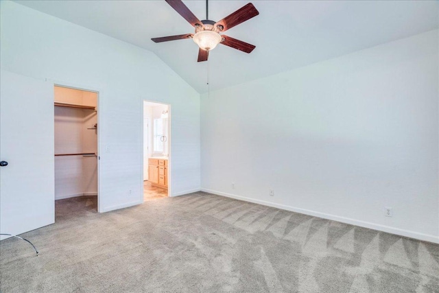 233 Sunshadow Dr, Lockhart, TX 78644 - unfurnished bedroom with lofted ceiling, light carpet, a spacious closet, a closet, and ensuite bath