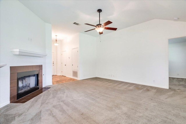 233 Sunshadow Dr, Lockhart, TX 78644 - unfurnished living room with carpet, a ceiling fan, lofted ceiling, and a fireplace
