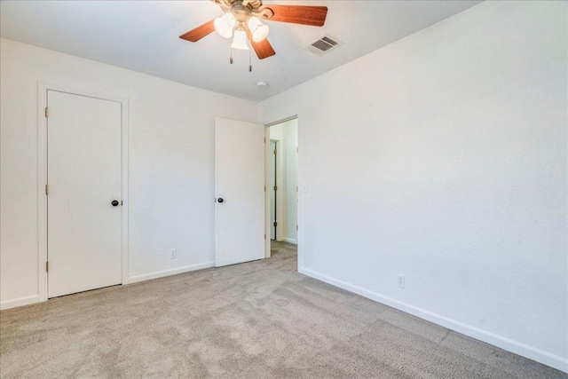 233 Sunshadow Dr, Lockhart, TX 78644 - unfurnished bedroom featuring carpet and ceiling fan