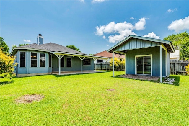 233 Sunshadow Dr, Lockhart, TX 78644 - back of house with a patio area and a chimney