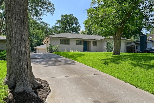 2507 Hartford Rd, Austin, TX 78703 - ranch-style house with stucco siding and a front lawn