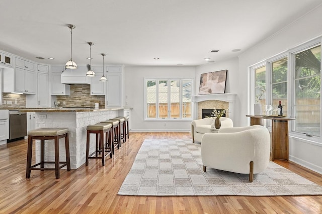 2507 Hartford Rd, Austin, TX 78703 - living room featuring healthy amount of natural light, light wood finished floors, a fireplace, and recessed lighting