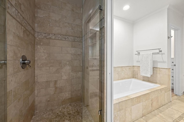 2507 Hartford Rd, Austin, TX 78703 - bathroom with ornamental molding, a shower stall, a bath, and tile patterned floors