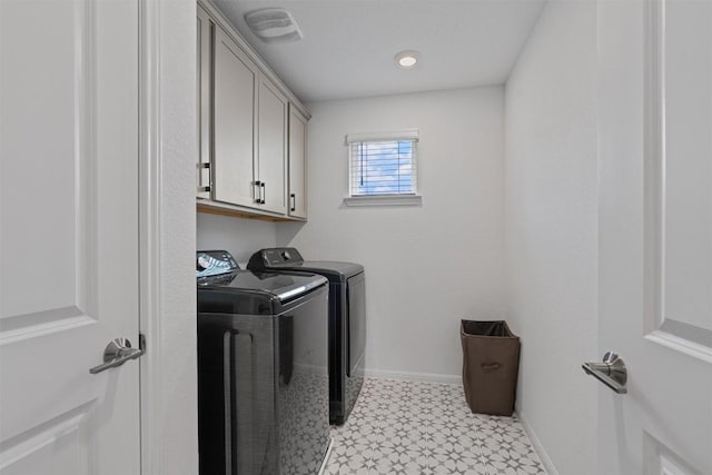 13506 Grand Central Dr, Pflugerville, TX 78660 - laundry area featuring washing machine and dryer, light flooring, and cabinet space