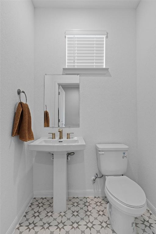 13506 Grand Central Dr, Pflugerville, TX 78660 - bathroom featuring toilet and baseboards