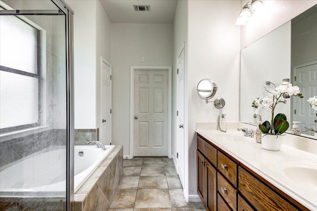 5521 Texas Bluebell Dr, Spicewood, TX 78669 - bathroom with double vanity, a bath, and a shower with shower door