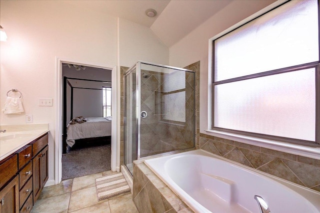 5521 Texas Bluebell Dr, Spicewood, TX 78669 - bathroom with a garden tub, plenty of natural light, a stall shower, and vaulted ceiling