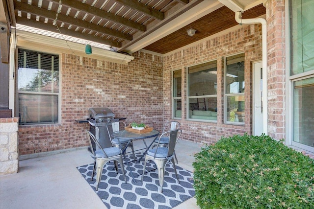 5521 Texas Bluebell Dr, Spicewood, TX 78669 - view of patio featuring a grill and outdoor dining area