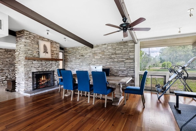1200 Redbud Trl, West Lake Hills, TX 78746 - dining room featuring a ceiling fan, wood-type flooring, and a stone fireplace