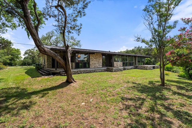 1200 Redbud Trl, West Lake Hills, TX 78746 - view of front of home with stone siding and a front lawn