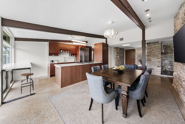 1200 Redbud Trl, West Lake Hills, TX 78746 - dining area with beam ceiling and dark aggregate flooring