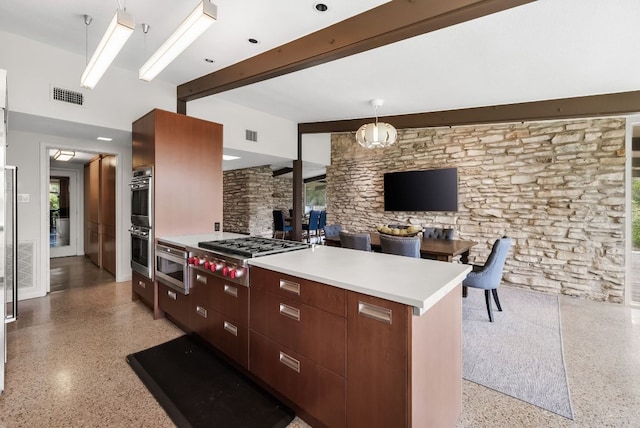 1200 Redbud Trl, West Lake Hills, TX 78746 - kitchen with dark aggregate flooring, appliances with stainless steel finishes, beamed ceiling, modern cabinets, and light countertops