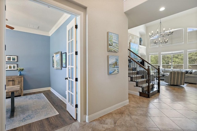 8709 Fescue Ln, Austin, TX 78738 - stairs with a chandelier, ornamental molding, a high ceiling, and recessed lighting