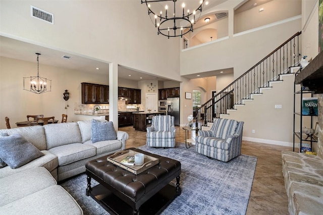 8709 Fescue Ln, Austin, TX 78738 - living area with a chandelier, a towering ceiling, tile patterned floors, and stairway