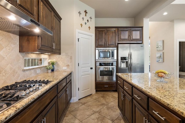 8709 Fescue Ln, Austin, TX 78738 - kitchen with appliances with stainless steel finishes, ventilation hood, light stone counters, dark brown cabinetry, and recessed lighting