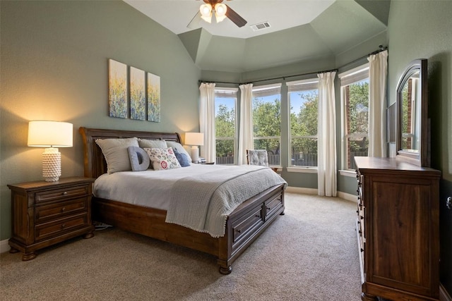 8709 Fescue Ln, Austin, TX 78738 - bedroom featuring light colored carpet, multiple windows, a ceiling fan, and vaulted ceiling