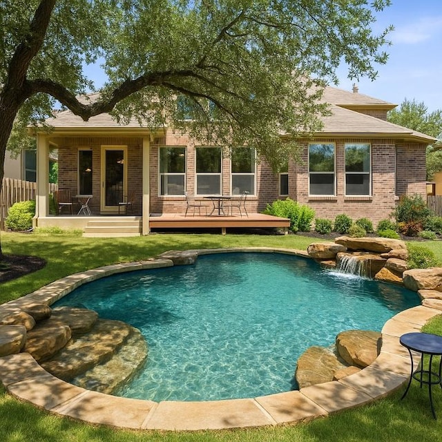 8709 Fescue Ln, Austin, TX 78738 - back of property featuring brick siding, a wooden deck, an outdoor pool, and roof with shingles