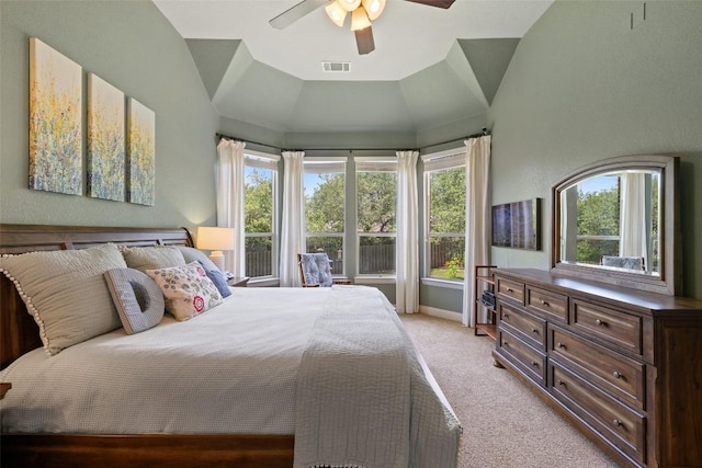 8709 Fescue Ln, Austin, TX 78738 - bedroom featuring light colored carpet, multiple windows, ceiling fan, and lofted ceiling