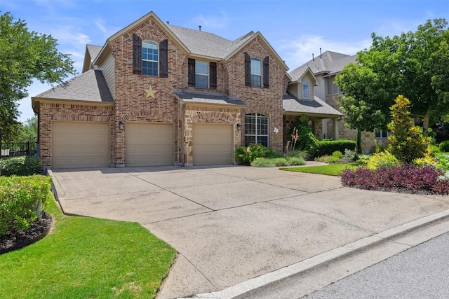 8709 Fescue Ln, Austin, TX 78738 - traditional-style house featuring brick siding, concrete driveway, a shingled roof, an attached garage, and a front lawn