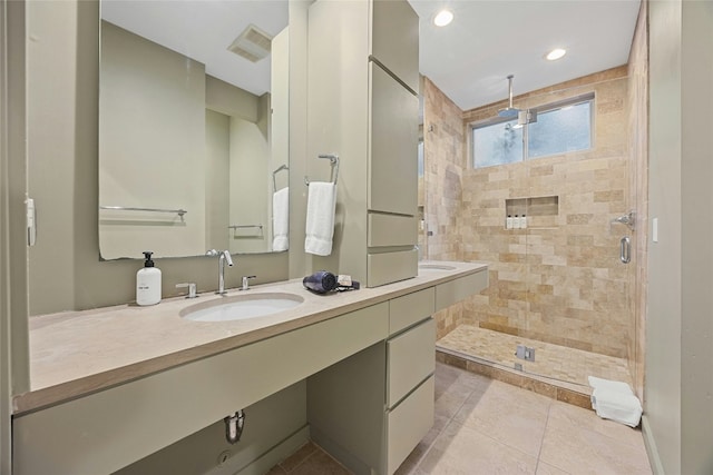 2909 Stratford Dr, Austin, TX 78746 - full bathroom featuring double vanity, a shower stall, tile patterned floors, and recessed lighting