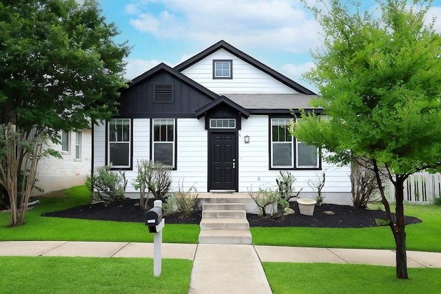 151 Campos, Kyle, TX 78640 - view of front of house featuring a front yard and board and batten siding