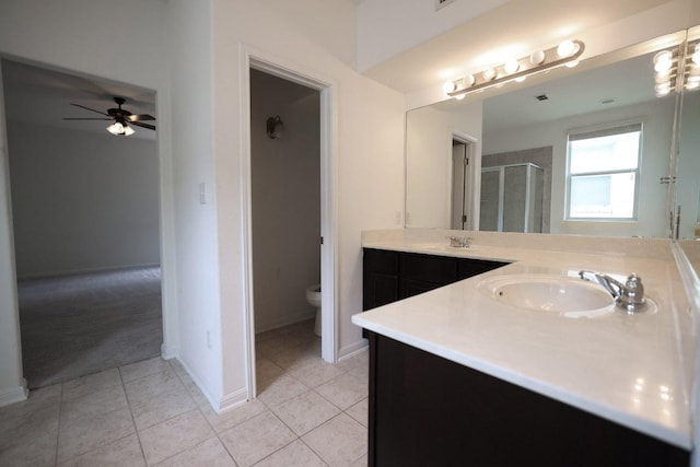 151 Campos, Kyle, TX 78640 - full bath with vanity, a stall shower, tile patterned floors, and a ceiling fan