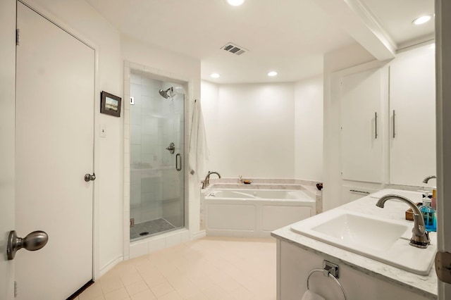 8200 Neely Dr Unit 119, Austin, TX 78759 - full bathroom featuring a shower stall, a bath, tile patterned flooring, recessed lighting, and double vanity