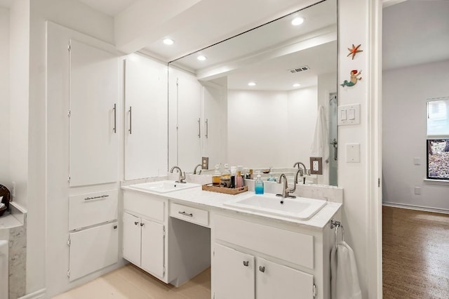 8200 Neely Dr Unit 119, Austin, TX 78759 - full bathroom featuring double vanity, recessed lighting, and wood finished floors