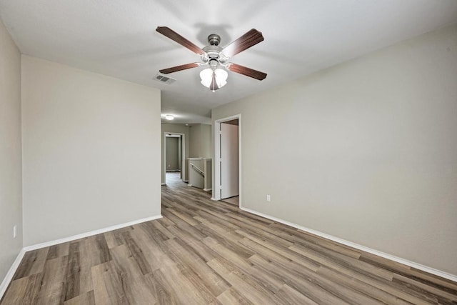 3417 Tralagon Trl, Pflugerville, TX 78660 - spare room featuring light wood-style floors and ceiling fan