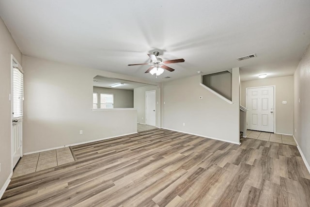 3417 Tralagon Trl, Pflugerville, TX 78660 - unfurnished living room featuring light wood finished floors and ceiling fan